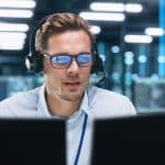 Man working at computer in industrial facility